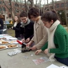 Olga, Amira and Danielle produce pins for every student who fills out a survey