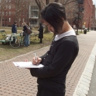 Tetsu Ohara, Coordinator of Green Week, fills out a survey